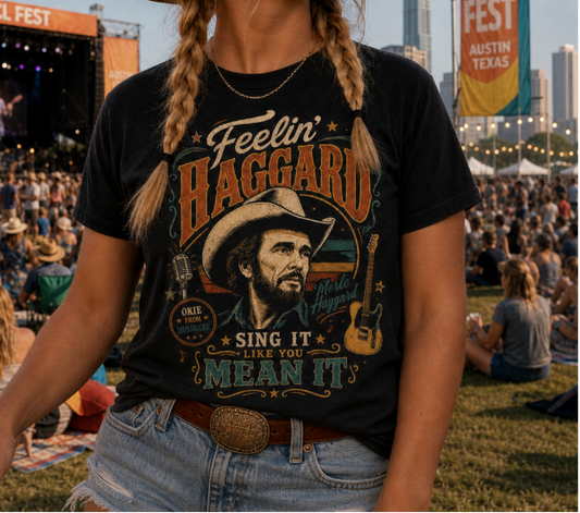Woman at ACL Fest wearing a 'Feelin' Haggard' t-shirt with a stage and crowd in the background.